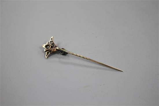 An early 20th century yellow and white metal, sapphire and diamond set stick pin, 62mm, gross weight 2.4 grams.